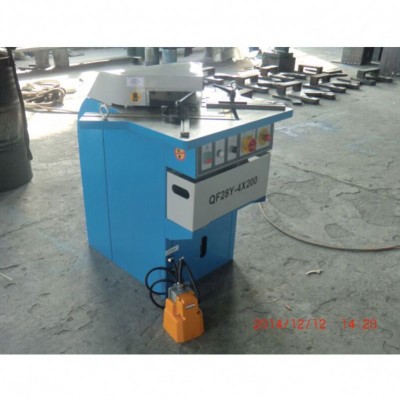 Removable material chute sheet metal corner notcher